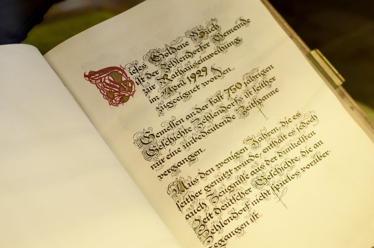 hero-img German manuscript with calligraphy text in an antique book, showcasing historical typography.